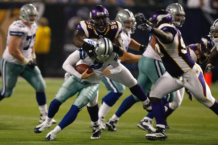 MINNEAPOLIS, MN - SEPTEMBER 4:  Fred Evans #90 and Letroy Guion #98 of the Minnesota Vikings sack quarterback Rudy Carpenter #5 of the Dallas Cowboys at Hubert H. Humphrey Metrodome on September 4, 2009 in Minneapolis, Minnesota. The Cowboys defeated the Vikings 35-31. <br /><br /><span class="help">(Photo by Scott Boehm/Getty Images)</span>