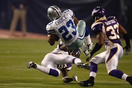 MINNEAPOLIS, MN - SEPTEMBER 4:  Running back Tashard Choice #23 of the Dallas Cowboys is hit by a defender during action against the Minnesota Vikings at Hubert H. Humphrey Metrodome on September 4, 2009 in Minneapolis, Minnesota. The Cowboys defeated the Vikings 35-31. <br /><br /><span class="help">(Photo by Scott Boehm/Getty Images)</span>