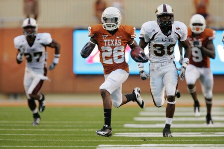 AUSTIN, TX - SEPTEMBER 05:  D.J. Monroe #26 of the Texas Longhorns returns a kickoff for a touchdown against the Louisiana Monroe Warhawks in the second quarter on September 5, 2009 at Darrell K Royal-Texas Memorial Stadium in Austin, Texas.  <br /><br /><span class="help">(Photo by Brian Bahr/Getty Images)</span>