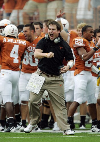AUSTIN, TX - SEPTEMBER 5:  Defensive coordinator Will Muschamp of the Texas Longhorns gets pumped up after a turnover by the Louisiana Monroe Warhawks in the first quarter on September 5, 2009 at Darrell K Royal-Texas Memorial Stadium in Austin, Texas.  <br /><br /><span class="help">(Photo by Brian Bahr/Getty Images)</span>