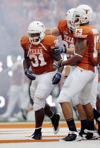 AUSTIN, TX - SEPTEMBER 05:  Running back Cody Johnson #31 of the Texas Longhorns celebrates his second touchdown against of the Louisiana Monroe Warhawks in the first quarter on September 5, 2009 at Darrell K Royal-Texas Memorial Stadium in Austin, Texas.  <br /><br /><span class="help">(Photo by Brian Bahr/Getty Images)</span>