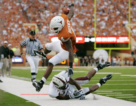 AUSTIN, TX - SEPTEMBER 5:  Wide receiver Dan Buckner #4 of the Texas Longhorns leaps as he gets knocked out of bounds with a first down, just short of the endzone against the Louisiana Monroe Warhawks in the second quarter on September 5, 2009 at Darrell K Royal-Texas Memorial Stadium in Austin, Texas.  <br /><br /><span class="help">(Photo by Brian Bahr/Getty Images)</span>