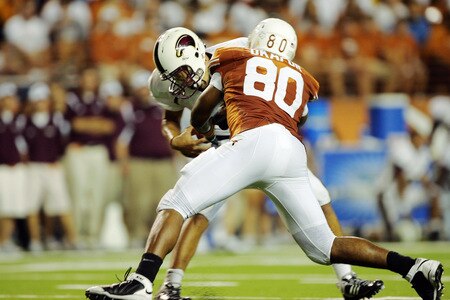 AUSTIN, TX - SEPTEMBER 5:  Alex Okafor #80 of the Texas Longhorns nearly sacks quarterback Trey Revell #12 of the Louisiana Monroe Warhawks in the fourth quarter on September 5, 2009 at Darrell K Royal-Texas Memorial Stadium in Austin, Texas.  Texas won 59-20.  <br /><br /><span class="help">(Photo by Brian Bahr/Getty Images)</span>