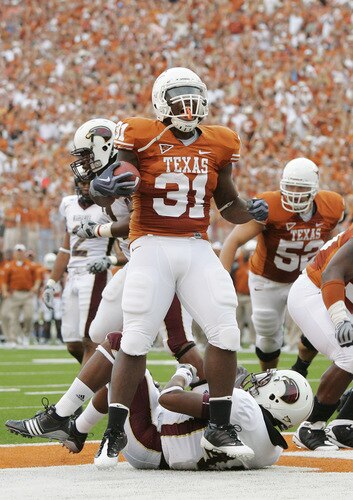 AUSTIN, TX - SEPTEMBER 05:  Running back Cody Johnson #31 of the Texas Longhorns celebrates after scoring his first touchdown against of the Louisiana Monroe Warhawks in the first quarter on September 5, 2009 at Darrell K Royal-Texas Memorial Stadium in Austin, Texas.  Texas won 59-20.  <br /><br /><span class="help">(Photo by Brian Bahr/Getty Images)</span>