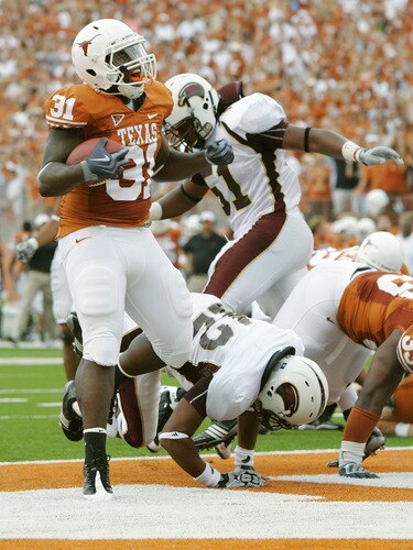 AUSTIN, TX - SEPTEMBER 05:  Running back Cody Johnson #31 of the Texas Longhorns celebrates after scoring his first touchdown against of the Louisiana Monroe Warhawks in the first quarter on September 5, 2009 at Darrell K Royal-Texas Memorial Stadium in Austin, Texas.  Texas won 59-20.  <br /><br /><span class="help">(Photo by Brian Bahr/Getty Images)</span>