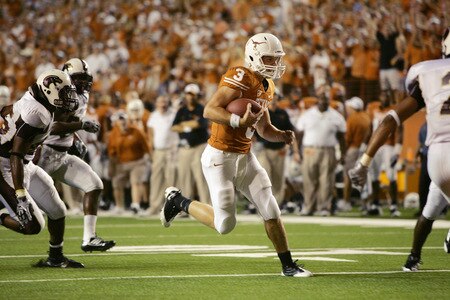 AUSTIN, TX - SEPTEMBER 5: Backup quarterback Garrett Gilbert #3 of the Texas Longhorns slips between the defense to score a touchdown against the Louisiana Monroe Warhawks in the fourth quarter on September 5, 2009 at Darrell K Royal-Texas Memorial Stadium in Austin, Texas.  Texas won 59-20.  <br /><br /><span class="help">(Photo by Brian Bahr/Getty Images)</span>