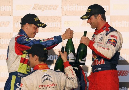 KINGSCLIFF, AUSTRALIA - SEPTEMBER 06:  Sebastien Loeb of France and the Citroen C4 Total team and Mikko Hirvonen of Finland and the BP Abu Dhabi Ford Focus team celebrate on the podium after the Repco Rally of Australia Special Stage 32 on September 6, 2009 in Kingscliff, Australia.  <br /><br /><span class="help">(Photo by Quinn Rooney/Getty Images)</span>