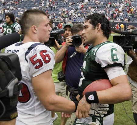 HOUSTON - SEPTEMBER 13:  Linebacker Brian Cushing #56 of the Houston Texans congratulates quarterback Mark Sanchez #6 of the New York Jets after the Jets defeated the Texans 24-7 at Reliant Stadium on September 13, 2009 in Houston, Texas. Cushing and Sanchez were roommates and teammates at USC.  <br /><br /><span class="help">(Photo by Bob Levey/Getty Images)</span>