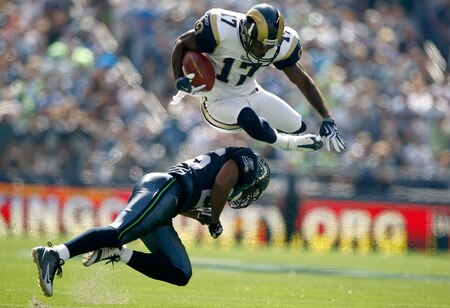 SEATTLE , WA - SEPTEMBER 13:  Donnie Avery #17 of the St. Louis Rams leaps over Josh Wilson #26 of the Seattle Seahawks at Qwest Field on September 13, 2009 in Seattle, Washington.  <br /><br /><span class="help">(Photo by Jonathan Ferrey/Getty Images)</span>
