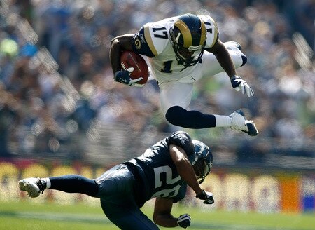 SEATTLE , WA - SEPTEMBER 13:  Donnie Avery #17 of the St. Louis Rams leaps over Josh Wilson #26 of the Seattle Seahawks at Qwest Field on September 13, 2009 in Seattle, Washington.  <br /><br /><span class="help">(Photo by Jonathan Ferrey/Getty Images)</span>