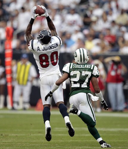 HOUSTON - SEPTEMBER 13:  Wide receiver Andre Johnson #80 of the Houston Texans makes a reception in front of cornerback Donald Strickland #27 of the new York Jets at Reliant Stadium on September 13, 2009 in Houston, Texas.  <br /><br /><span class="help">(Photo by Bob Levey/Getty Images)</span>