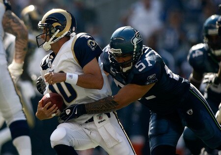 SEATTLE , WA - SEPTEMBER 13:  Lofa Tatupu #51 of the Seattle Seahawks sacks Marc Bugler #10 of the St. Louis Rams at Qwest Field on September 13, 2009 in Seattle, Washington.  <br /><br /><span class="help">(Photo by Jonathan Ferrey/Getty Images)</span>