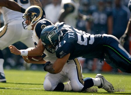 SEATTLE , WA - SEPTEMBER 13:  Lofa Tatupu #51 of the Seattle Seahawks sacks Marc Bugler #10 of the St. Louis Rams at Qwest Field on September 13, 2009 in Seattle, Washington.  <br /><br /><span class="help">(Photo by Jonathan Ferrey/Getty Images)</span>