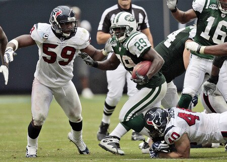 HOUSTON - SEPTEMBER 13: Running back Leon Washington #29 of the New York Jets breaks the tackle of free safety John Bussing #40 of the Houston Texans as linebacker DeMeco Ryans pursues on the play at Reliant Stadium on September 13, 2009 in Houston, Texas.  <br /><br /><span class="help">(Photo by Bob Levey/Getty Images)</span>