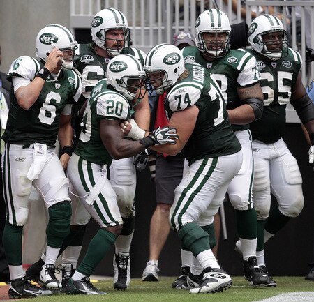 HOUSTON - SEPTEMBER 13: Running back Thomas Jones #20 of the New York Jets celebrates with quarterback Mark Sanchez #6 and center Nick Mangold #74 after scoring on a 38 yard run in the fourth quarter at Reliant Stadium on September 13, 2009 in Houston, Texas.  <br /><br /><span class="help">(Photo by Bob Levey/Getty Images)</span>