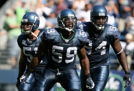 SEATTLE - SEPTEMBER 13:  Linebacker Aaron Curry #59 of the Seattle Seahawks, celebrates with teammates Lofa Tatupu #51 and Cory Redding #94 after sacking quarterback Marc Bulger #10 of the St. Louis Rams on September 13, 2009 at Qwest Field in Seattle, Washington. The Seahawks defeated the Rams 28-0. <br /><br /><span class="help">(Photo by Otto Greule Jr/Getty Images)</span>