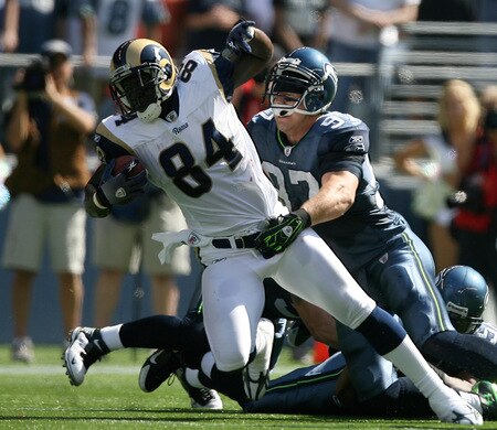 SEATTLE - SEPTEMBER 13:  Tight end Randy McMichael #84 of the St. Louis Rams battles Patrick Kerney #97 of the Seattle Seahawks on September 13, 2009 at Qwest Field in Seattle, Washington. The Seahawks defeated the Rams 28-0. <br /><br /><span class="help">(Photo by Otto Greule Jr/Getty Images)</span>