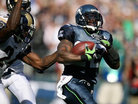 SEATTLE - SEPTEMBER 13:  Running back Julius Jones #22 of the Seattle Seahawks rushes for a touchdown in the third quarter against Ron Bartell #24 of the St. Louis Rams on September 13, 2009 at Qwest Field in Seattle, Washington. The Seahawks defeated the Rams 28-0. <br /><br /><span class="help">(Photo by Otto Greule Jr/Getty Images)</span>