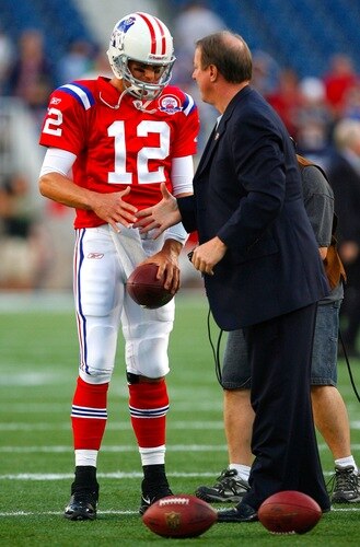 FOXBORO, MA - SEPTEMBER 14:  Quarterback Tom Brady #12 of the New England Patriots greets Hall of Fame quarterback for the Buffalo Bills Jim Kelly before the game between the Patriots and the Bills on September 14, 2009 at Gillette Stadium in Foxboro, Massachusetts. <br /><br /><span class="help">(Photo by Jim Rogash/Getty Images)</span>