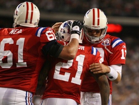 FOXBORO, MA - SEPTEMBER 14:  Quarterback Tom Brady #12 of the New England Patriots congratulates running back Fred Taylor #21 after scoring a touchdown in the second quarter of the game against the Buffalo Bills on September 14, 2009 at Gillette Stadium in Foxboro, Massachusetts. <br /><br /><span class="help">(Photo by Jim Rogash/Getty Images)</span>