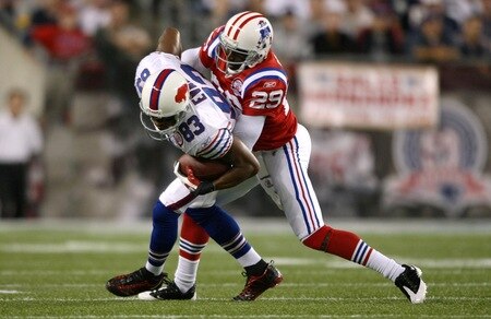 FOXBORO, MA - SEPTEMBER 14:  Lee Evans #83 of the Buffalo Bills is tackled by Shawn Springs #29 of the New England Patriots on September 14, 2009 at Gillette Stadium in Foxboro, Massachusetts. <br /><br /><span class="help">(Photo by Elsa/Getty Images)</span>