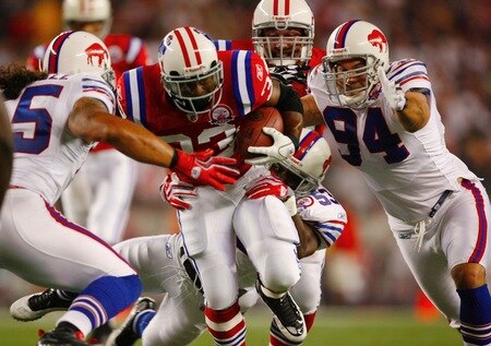 FOXBORO, MA - SEPTEMBER 14:  Running back Kevin Faulk #33 of the New England Patriots tries to break through the Buffalo Bills defense during the second quarter on September 14, 2009 at Gillette Stadium in Foxboro, Massachusetts. <br /><br /><span class="help">(Photo by Jim Rogash/Getty Images)</span>