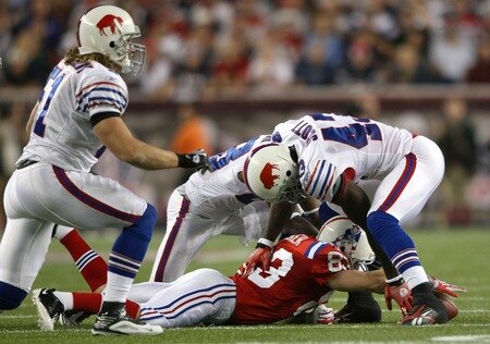 FOXBORO, MA - SEPTEMBER 14:  Wes Welker #83 of the New England Patriots reaches for a loose ball against Bryan Scott #43 and Leodis McKelvin #28 of the Buffalo Bills on September 14, 2009 at Gillette Stadium in Foxboro, Massachusetts. <br /><br /><span class="help">(Photo by Elsa/Getty Images)</span>