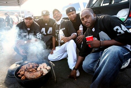 OAKLAND, CA - SEPTEMBER 14:  Fans of the Oakland Raiders pose for a photo as they tailgate in the parking lot prior to the Raiders playing against the San Diego Chargers on September 14, 2009 at the Oakland-Alameda County Coliseum in Oakland, California.  <br /><br /><span class="help">(Photo by (Ezra Shaw/Getty Images)</span>