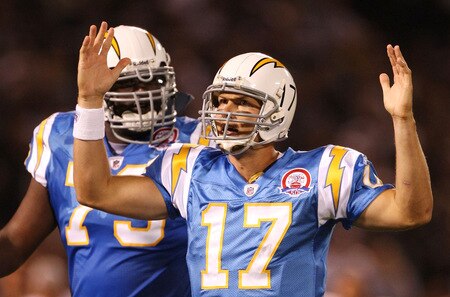 OAKLAND, CA - SEPTEMBER 14:  Quarterback Philip Rivers #17 of the San Diego Chargers celebrates after LaDainian Tomlinson #21 scored a 1-yard rushing touchdown in the first quarter against the Oakland Raiders on September 14, 2009 at the Oakland-Alameda County Coliseum in Oakland, California.  <br /><br /><span class="help">(Photo by Ezra Shaw/Getty Images)</span>