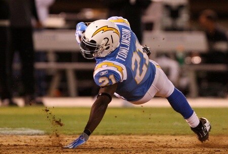 OAKLAND, CA - SEPTEMBER 14:  LaDainian Tomlinson #21 of the San Diego Chargers falls to the turf after he ws tripped up on a running play against the Oakland Raiders on September 14, 2009 at the Oakland-Alameda County Coliseum in Oakland, California.  <br /><br /><span class="help">(Photo by Ezra Shaw/Getty Images)</span>