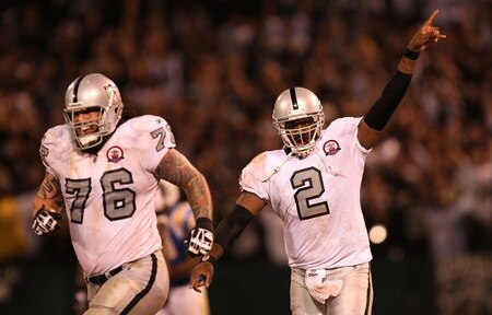 OAKLAND, CA - SEPTEMBER 14:  (L-R) Robert Gallery #76 and JaMarcus Russell #2 of the Oakland Raiders celebrate after Russell threw a 57-yard touchdown pass to Louis Murphy #18 in the fourth quarter against the San Diego Chargers on September 14, 2009 at the Oakland-Alameda County Coliseum in Oakland, California.  <br /><br /><span class="help">(Photo by Ezra Shaw/Getty Images)</span>