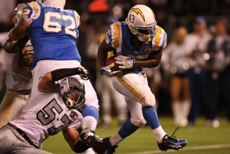 OAKLAND, CA - SEPTEMBER 14:  Darren Sproles #43 of the San Diego Chargers scores the game-winning touchdown on a 5-yard rushing TD in the fourth quarter against Ricky Brown #57 of the Oakland Raiders on September 14, 2009 at the Oakland-Alameda County Coliseum in Oakland, California.  <br /><br /><span class="help">(Photo by Ezra Shaw/Getty Images)</span>