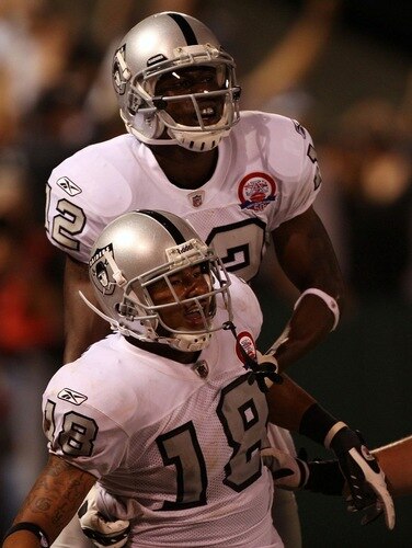 OAKLAND, CA - SEPTEMBER 14:  Louis Murphy #18 (bottom) and Darrius Heyward-Bey #12 of the Oakland Raiders celebrate after Murphy scored on a 57-yard touchdown reception in the fourth quarter against the San Diego Chargers on September 14, 2009 at the Oakland-Alameda County Coliseum in Oakland, California.  <br /><br /><span class="help">(Photo by Ezra Shaw/Getty Images)</span>