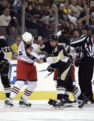 PITTSBURGH, PA - SEPTEMBER 15:  Deryk Engelland #5 of the Pittsburgh Penguins fights with Doug Lynch #82 of Columbus Blue Jackets in the first period at Mellon Arena on September 15, 2009 in Pittsburgh, Pennsylvania.  <br /><br /><span class="help">(Photo by Justin K. Aller/Getty Images)</span>