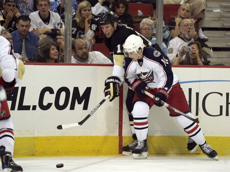 PITTSBURGH, PA - SEPTEMBER 15:  Jordan Staal #11 of the Pittsburgh Penguins passes the puck against Kris Russell #10 of the Columbus Blue Jackets in the second period at Mellon Arena on September 15, 2009 in Pittsburgh, Pennsylvania.  <br /><br /><span class="help">(Photo by Justin K. Aller/Getty Images)</span>