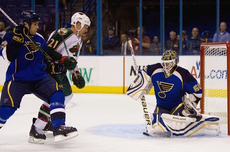 ST. LOUIS, MO. - SEPTEMBER 15: Mike Weaver #43 and Chris Mason #50 both of the St. Louis Blues defend against Kyle Brodziak #21 of the Minnesota Wild  at the Scottrade Center on September 15, 2009 in St. Louis, Missouri.  <br /><br /><span class="help">(Photo by Dilip Vishwanat/Getty Images)</span>