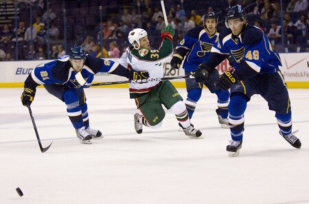 ST. LOUIS, MO. - SEPTEMBER 15: Jamie Fraser #39 of the Minnesota Wild is looks to control the puck against Patrik Berglund #21, Andy McDonald #10 and Steve Wagner #49 all of the St. Louis Blues at the Scottrade Center on September 15, 2009 in St. Louis, Missouri.  <br /><br /><span class="help">(Photo by Dilip Vishwanat/Getty Images)</span>