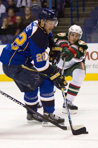 ST. LOUIS, MO. - SEPTEMBER 15: Brad Boyes #22 of the St. Louis Blues moves the puck up ice against Marco Scandella #64 the Minnesota Wild at the Scottrade Center on September 15, 2009 in St. Louis, Missouri.  <br /><br /><span class="help">(Photo by Dilip Vishwanat/Getty Images)</span>