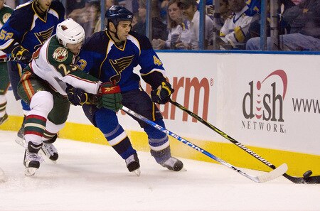 ST. LOUIS, MO. - SEPTEMBER 15: Petr Kalus #23 of the Minnesota Wild looks to steal the puck from Mike Weaver #43 of the St. Louis Blues at the Scottrade Center on September 15, 2009 in St. Louis, Missouri.  The Blues beat the Wild 3-1.  <br /><br /><span class="help">(Photo by Dilip Vishwanat/Getty Images)</span>