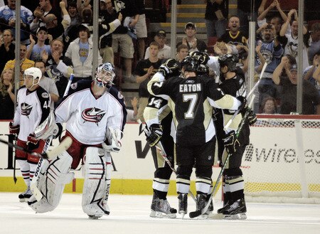 PITTSBURGH, PA - SEPTEMBER 15:  Kris Kunitz #14 of the Pittsburgh Penguins celebrates his overtime winning goal as goaltender Dan LaCosta #30 of the Columbus Blue Jackets skates off the ice at Mellon Arena on September 15, 2009 in Pittsburgh, Pennsylvania.  <br /><br /><span class="help">(Photo by Justin K. Aller/Getty Images)</span>