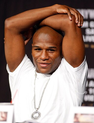 LAS VEGAS - SEPTEMBER 16:  Boxer Floyd Mayweather Jr. stretches during the final news conference for his bout against Juan Manuel Marquez at the MGM Grand Hotel/Casino September 16, 2009 in Las Vegas, Nevada. The two will fight at the MGM Grand Garden Arena on September 19 in Las Vegas.  <br /><br /><span class="help">(Photo by Ethan Miller/Getty Images)</span>