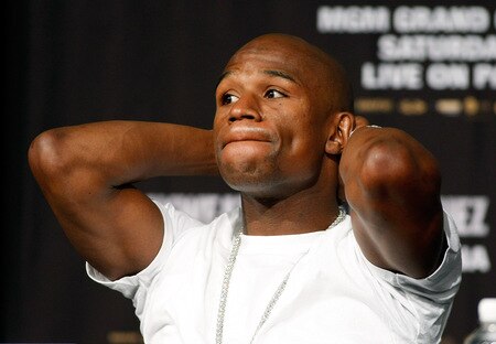 LAS VEGAS - SEPTEMBER 16:  Boxer Floyd Mayweather Jr. stretches during the final news conference for his bout against Juan Manuel Marquez at the MGM Grand Hotel/Casino September 16, 2009 in Las Vegas, Nevada. The two will fight at the MGM Grand Garden Arena on September 19 in Las Vegas.  <br /><br /><span class="help">(Photo by Ethan Miller/Getty Images)</span>
