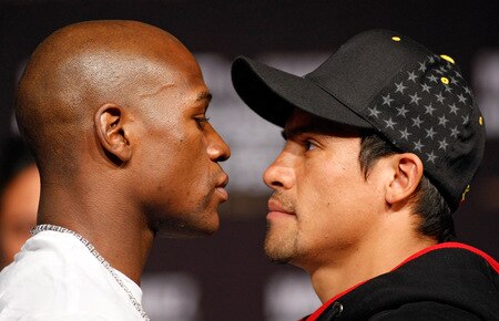 LAS VEGAS - SEPTEMBER 16:  Boxers Floyd Mayweather Jr. (L) and Juan Manuel Marquez face off during their final news conference at the MGM Grand Hotel/Casino September 16, 2009 in Las Vegas, Nevada. The two will fight at the MGM Grand Garden Arena on September 19 in Las Vegas.  <br /><br /><span class="help">(Photo by Ethan Miller/Getty Images)</span>