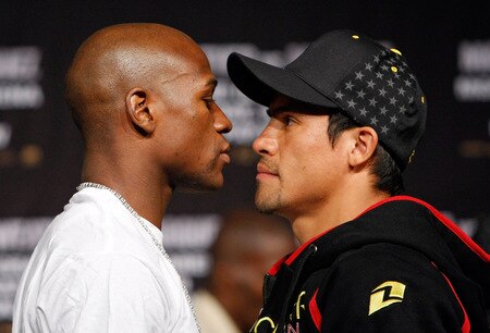 LAS VEGAS - SEPTEMBER 16:  Boxers Floyd Mayweather Jr. (L) and Juan Manuel Marquez face off during their final news conference at the MGM Grand Hotel/Casino September 16, 2009 in Las Vegas, Nevada. The two will fight at the MGM Grand Garden Arena on September 19 in Las Vegas.  <br /><br /><span class="help">(Photo by Ethan Miller/Getty Images)</span>