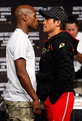 LAS VEGAS - SEPTEMBER 16:  Boxers Floyd Mayweather Jr. (L) and Juan Manuel Marquez face off during their final news conference at the MGM Grand Hotel/Casino September 16, 2009 in Las Vegas, Nevada. The two will fight at the MGM Grand Garden Arena on September 19 in Las Vegas.  <br /><br /><span class="help">(Photo by Ethan Miller/Getty Images)</span>