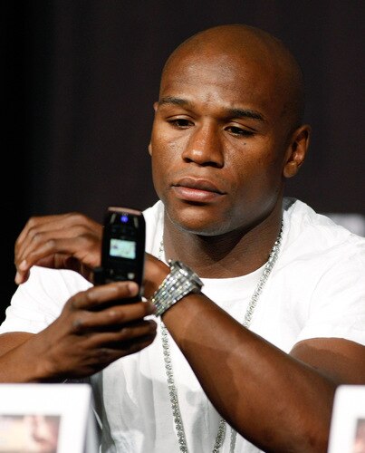 LAS VEGAS - SEPTEMBER 16:  Boxer Floyd Mayweather Jr. uses a cell phone during the final news conference for his bout against Juan Manuel Marquez at the MGM Grand Hotel/Casino September 16, 2009 in Las Vegas, Nevada. The two will fight at the MGM Grand Garden Arena on September 19 in Las Vegas.  <br /><br /><span class="help">(Photo by Ethan Miller/Getty Images)</span>