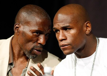 LAS VEGAS - SEPTEMBER 16:  Boxer Floyd Mayweather Jr. (R) and his uncle and trainer Roger Mayweather confer during the final news conference for their bout against Juan Manuel Marquez at the MGM Grand Hotel/Casino September 16, 2009 in Las Vegas, Nevada. Mayweather and Marquez will fight at the MGM Grand Garden Arena on September 19 in Las Vegas.  <br /><br /><span class="help">(Photo by Ethan Miller/Getty Images)</span>