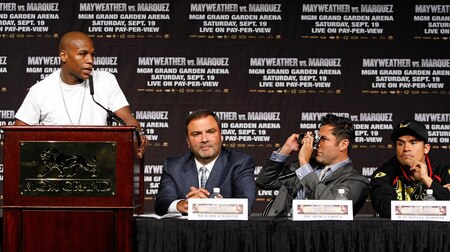 LAS VEGAS - SEPTEMBER 16:  (L-R) Boxer Floyd Mayweather Jr. speaks as Golden Boy Promotions CEO Richard Schaefer, boxing promoter Oscar De La Hoya and boxer Juan Manuel Marquez listen during the final news conference for the Marquez-Mayweather bout at the MGM Grand Hotel/Casino September 16, 2009 in Las Vegas, Nevada. Marquez and Mayweather will fight at the MGM Grand Garden Arena on September 19 in Las Vegas.  <br /><br /><span class="help">(Photo by Ethan Miller/Getty Images)</span>
