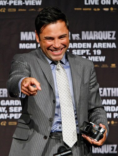 LAS VEGAS - SEPTEMBER 16:  Boxing promoter Oscar De La Hoya smiles during the final news conference for the Juan Manuel Marquez and Floyd Mayweather Jr. bout at the MGM Grand Hotel/Casino September 16, 2009 in Las Vegas, Nevada. Marquez and Mayweather will fight at the MGM Grand Garden Arena on September 19 in Las Vegas.  <br /><br /><span class="help">(Photo by Ethan Miller/Getty Images)</span>