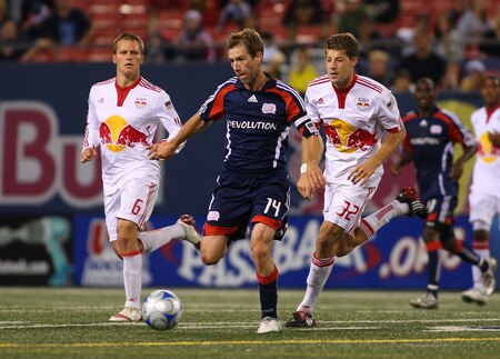 EAST RUTHERFORD, NJ - SEPTEMBER 18:  Steve Ralston #14 of the New England Revolution plays the ball against Luke Sassano #32 and Seth Stammler #6 of the New York Red Bulls at Giants Stadium in the Meadowlands on September 18, 2009 in East Rutherford, New Jersey.  <br /><br /><span class="help">(Photo by Mike Stobe/Getty Images for New York Red Bull)</span>